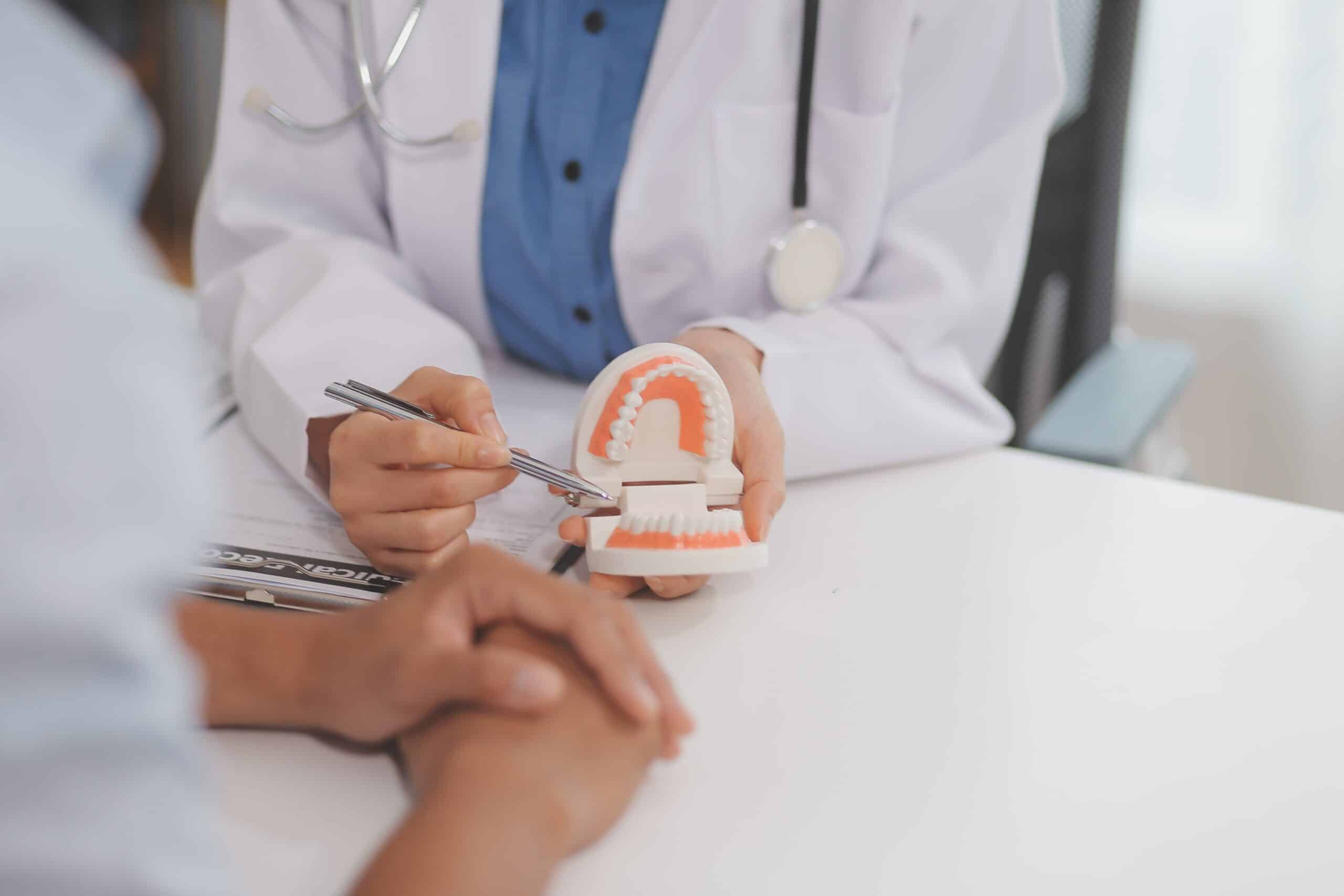 Dentist Consultation Patient Visit At The Dental Clinic Office.
